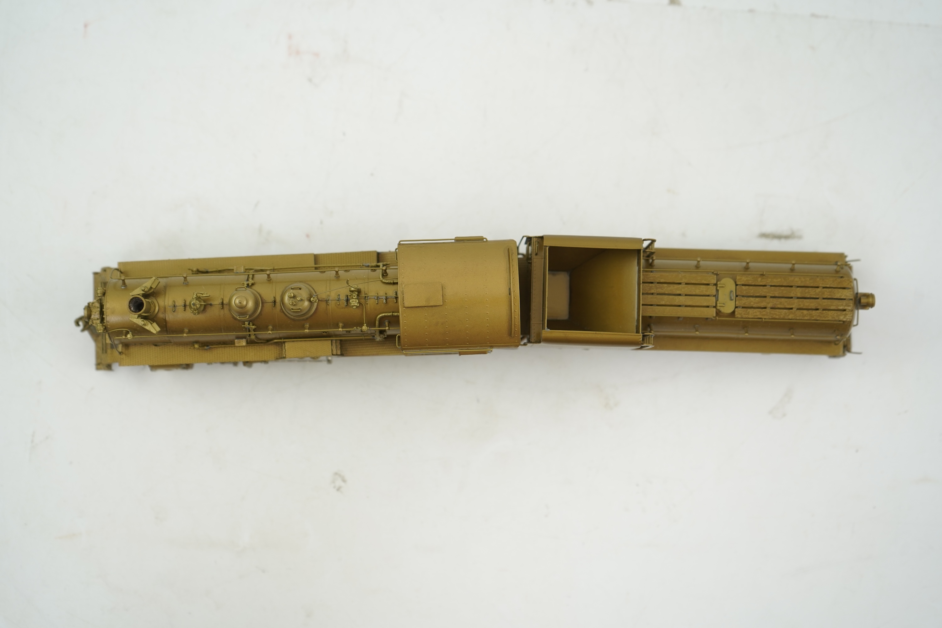 A boxed HO gauge Overland Models Inc. J.P.M. unpainted brass model of Union Pacific Railway C-57, 2-8-0 locomotive with bogie tender, powered for two rail operation.